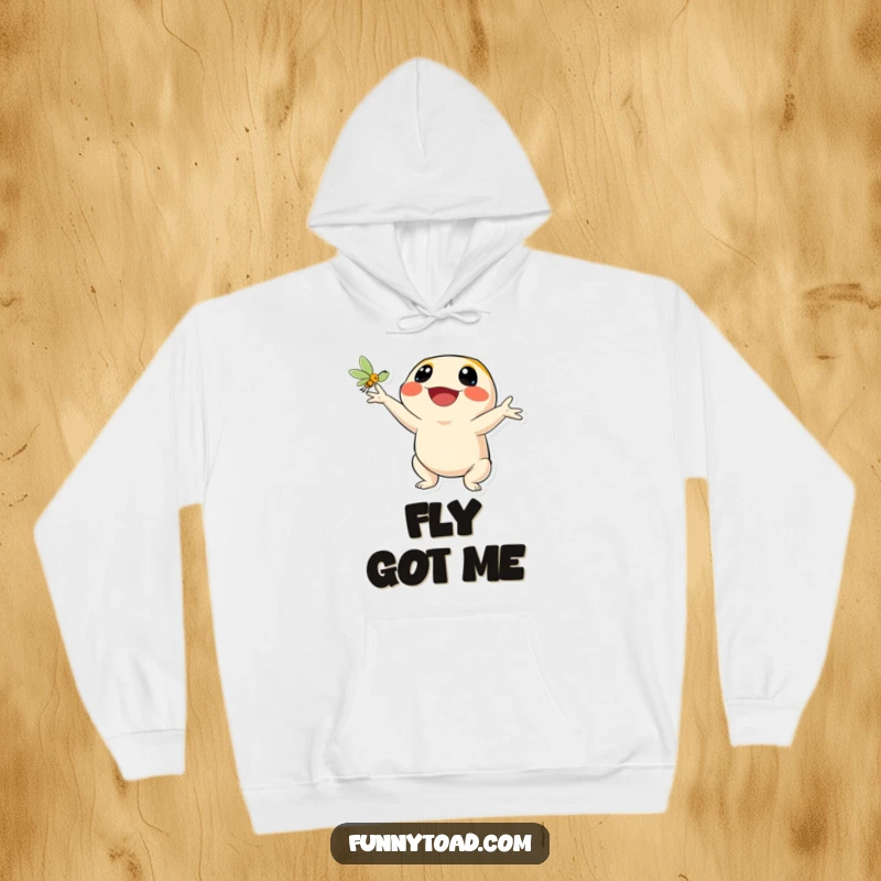 Funny hoodie showing a happy toad character joyfully catching a fly with its tongue out. Warm and humorous athleisure.