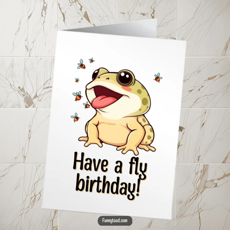 Funny Free Printable Birthday Card: A smiling toad expertly juggling colorful flies with its long tongue in a celebration of fun.